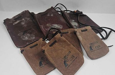 Set 6 Cowboy Leather Shooting Pouches. A collection of six leather drawstring pouches of the 