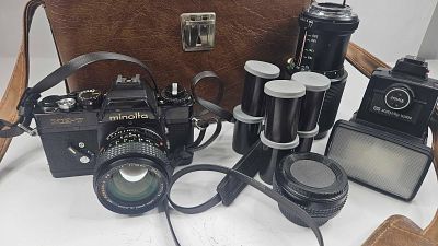 Minolta XE-7 SLR Camera w/ 50mm Lens. This photographic collection features a Minolta XE-7 35mm 