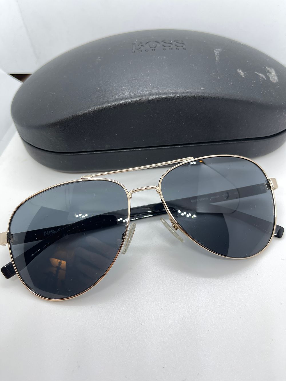 Lot 189: Hugo Boss men’s aviators sunglasses ex demo from a private jet charter, gold plated with box for condition please look at photos.