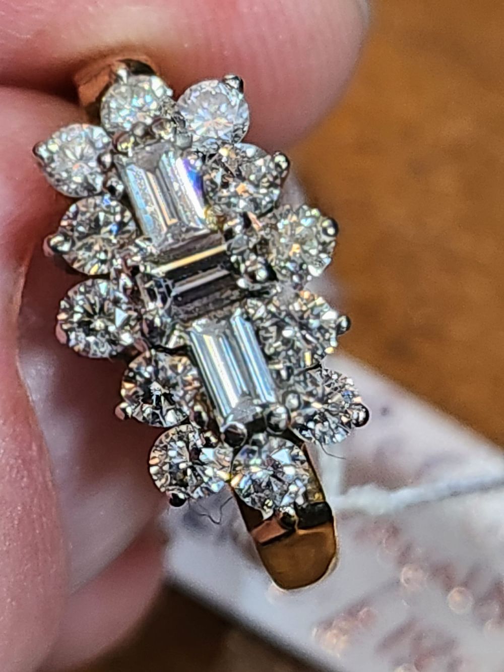 Lot 179: 18ct yellow gold with platinum setting. Over 1ct worth of diamonds fully hallmarked size M