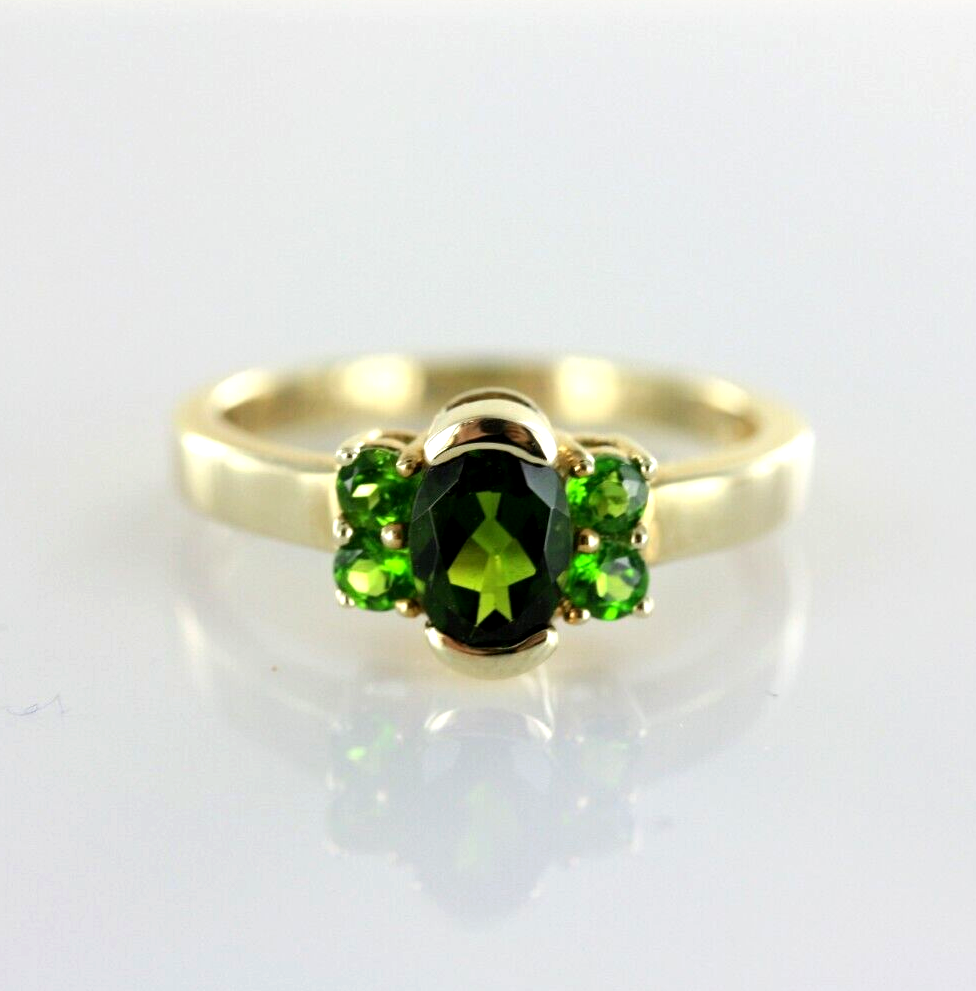 Lot 238: 9CT YELLOW GOLD HALLMARKED 375 DIOPSIDE 5 STONE DESIGNER STYLE DRESS RING ITEM DESCRIPTION 9ct Yellow Gold Hallmarked Diopside 5 Stone Dress Ring This stunning ring will be professionally cleaned/polished and ready to wear. Fully hallmarked for 9ct solid