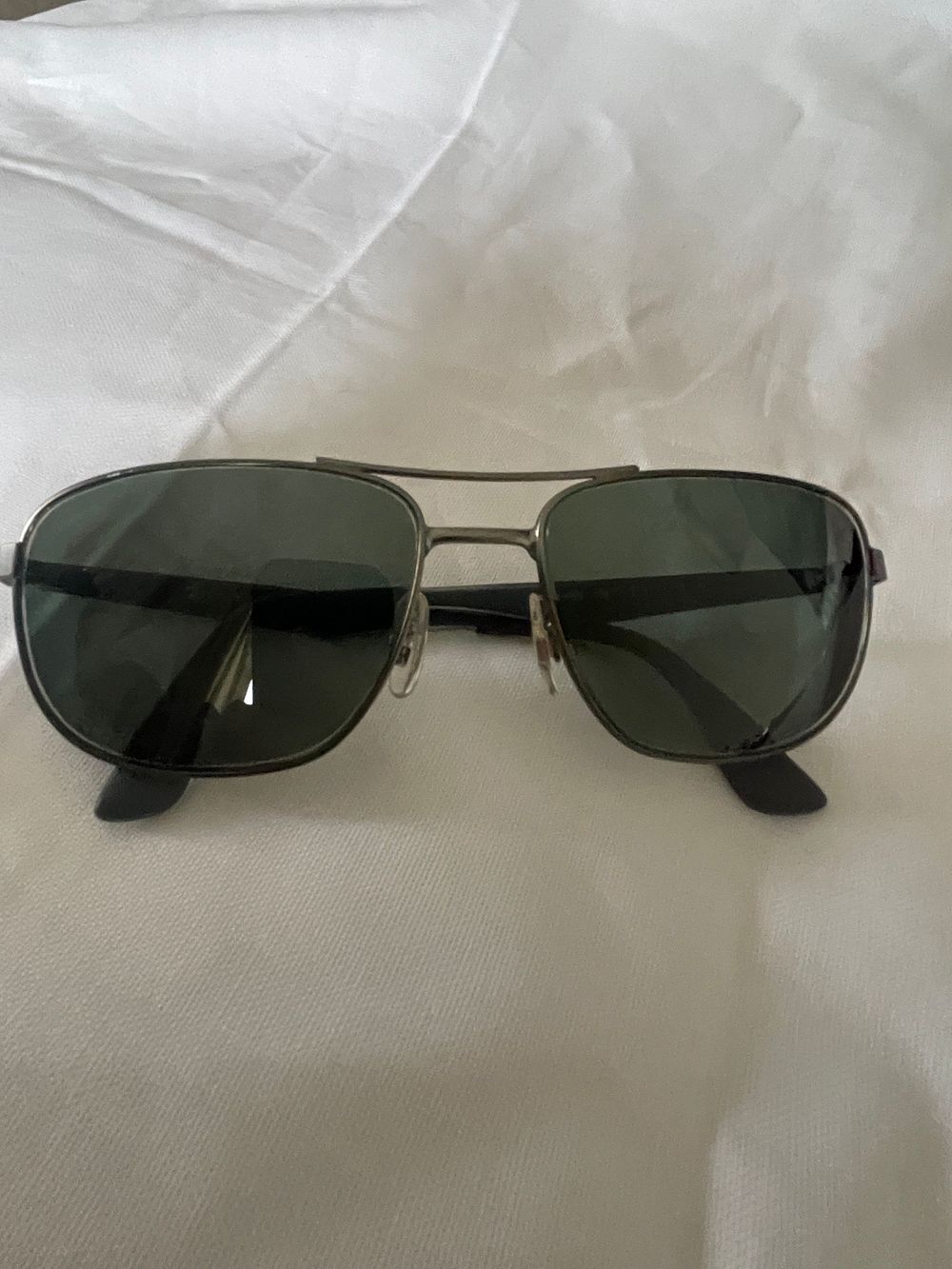 Lot 316: Ray Ban sunglasses, lost property from a private jet charter.