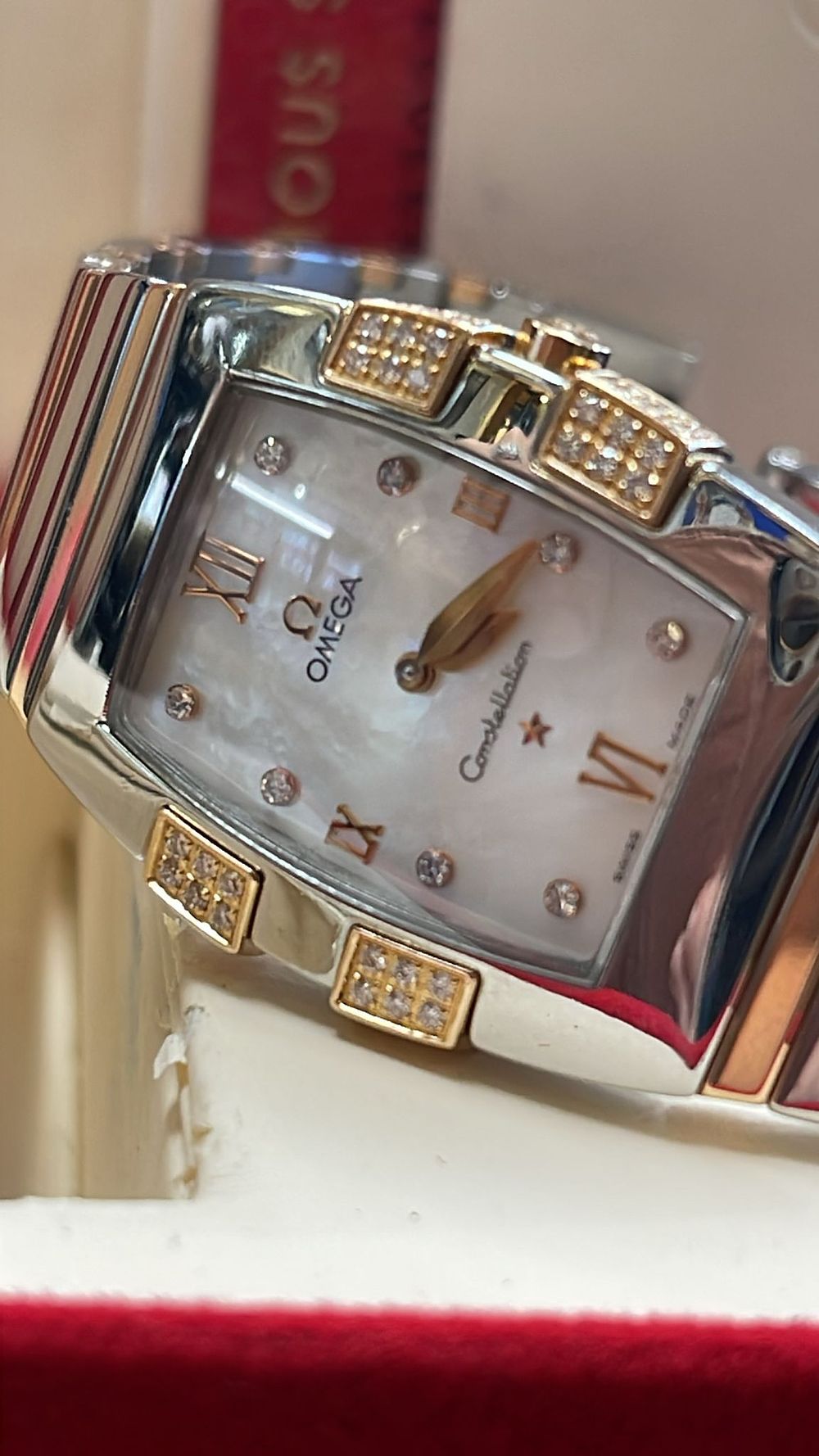 Lot 345: 32x24 quadrella omega with rose gold barons and diamonds mother of pearl face. Diamond dot dial .