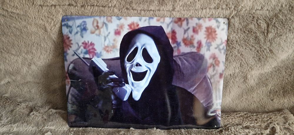 Lot 1051: Halloween scary movie tin sign.