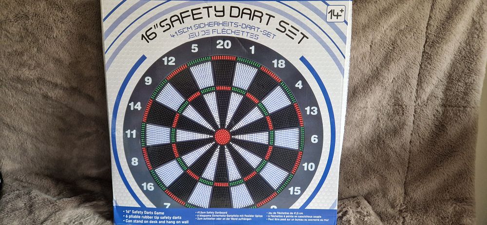Lot 1080: 16-inch safety dart set featuring a soft tip board and 6 pliable rubber tip safety darts.