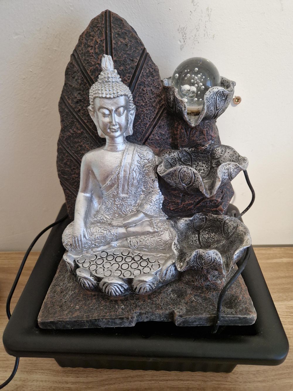 Lot 1249: Nirvana Indoor Water Fountain with a silver Buddha statue.