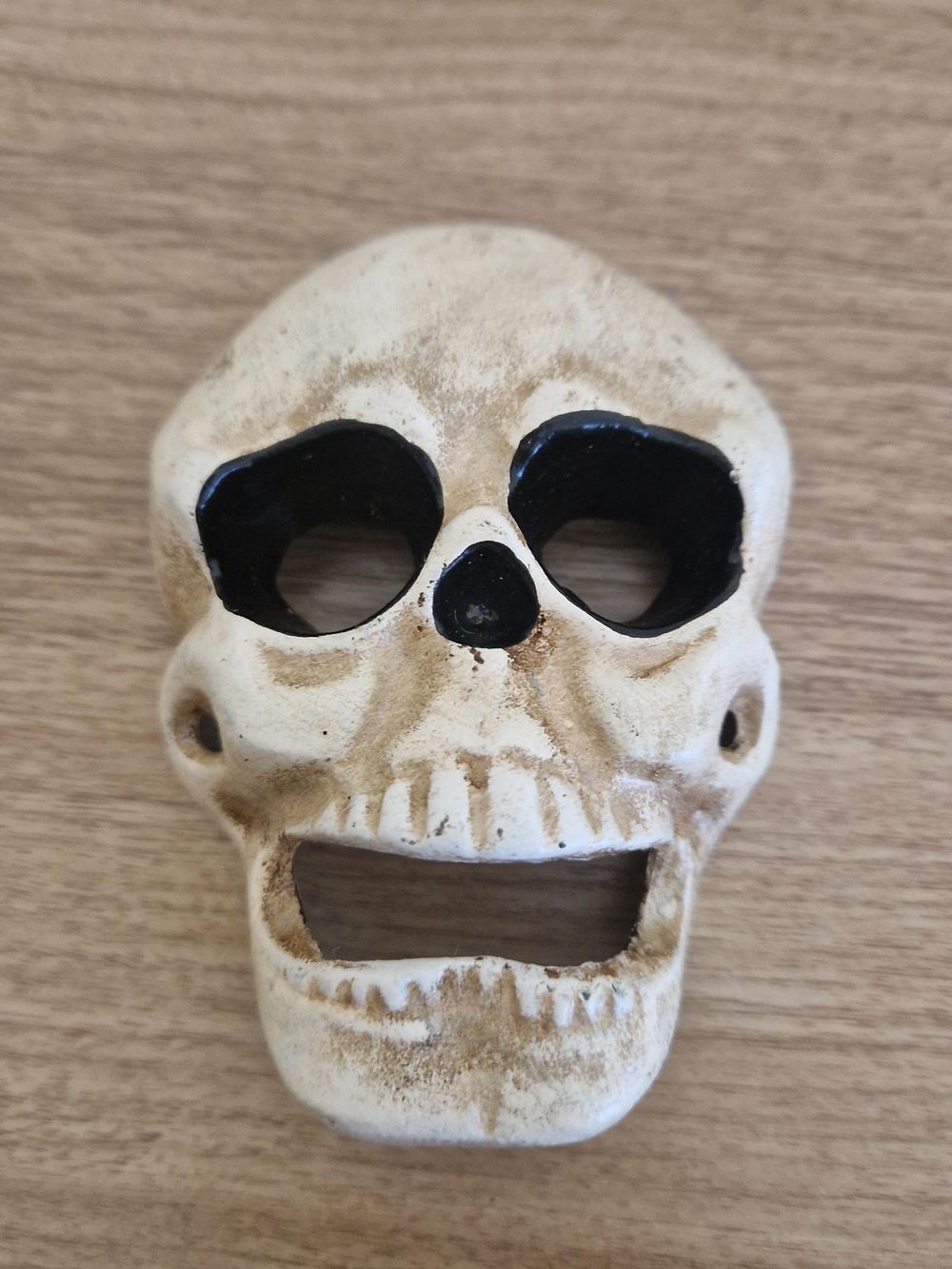Lot 1364: Cast iron skull bottle opener.