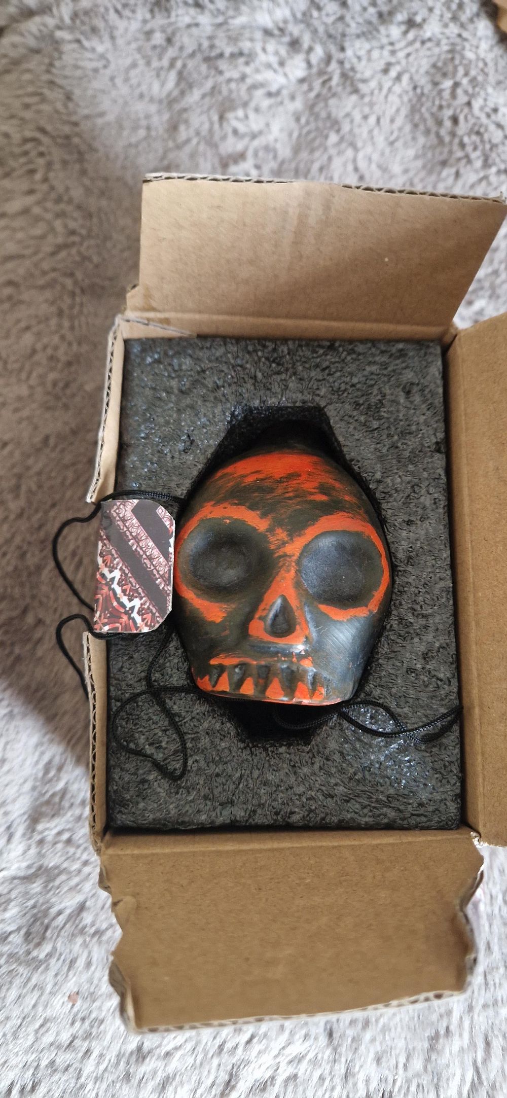 Lot 62: Aztec death whistle, a ceramic replica of an ancient instrument crafted to resemble a skull.