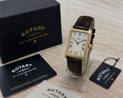 Swiss Made Rotary Style Rectangular Wristwatch Gold Tone Case Cream Dial Classic Dress Watch. Des 