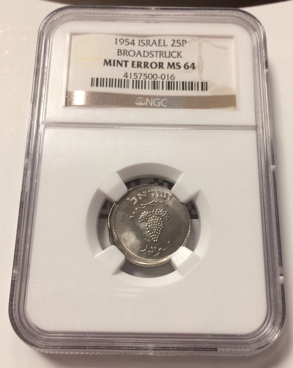 Israel , Coin with Broadstruck and look like off center Error in 25 pruta 1954 graded by NGC MS 