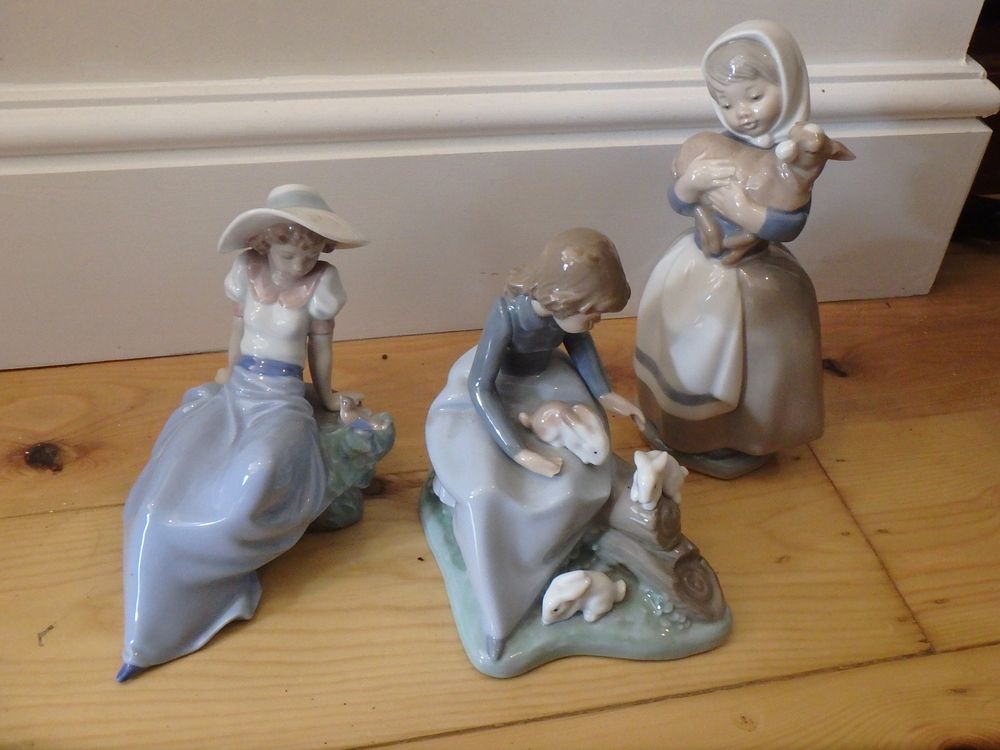 Lot 64: Three Nao Figurines
