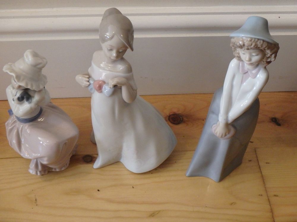 Lot 66: Three Nao Figurines