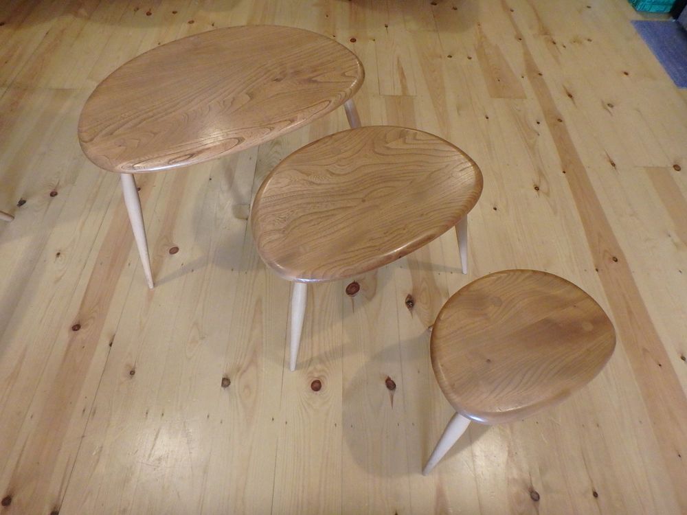 Lot 557: Mid-century Ercol Pebble Nest of Three Tables