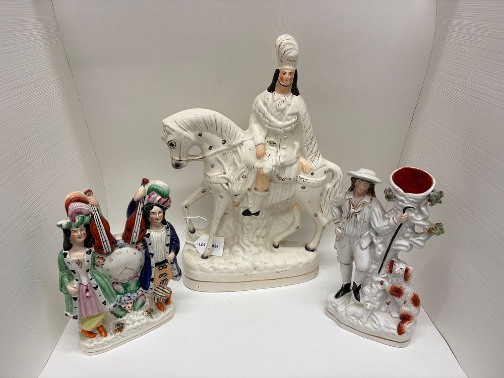 Lot 634: Three Staffordshire ornaments