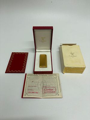 Cartier Gold-Plated Gas Lighter with Original Box, Papers, and Tool, Dated 1987. A Cartier 