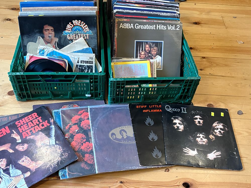 Lot 472: A Collection of 1970s and 1980s Rock and Pop Vinyl Records with a Bush Portable Record Player