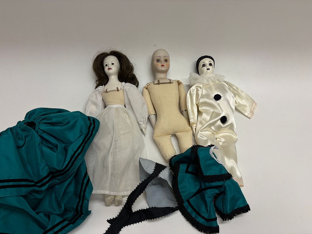 Lot 519: Three Vintage Porcelain and Bisque Dolls with Clothing