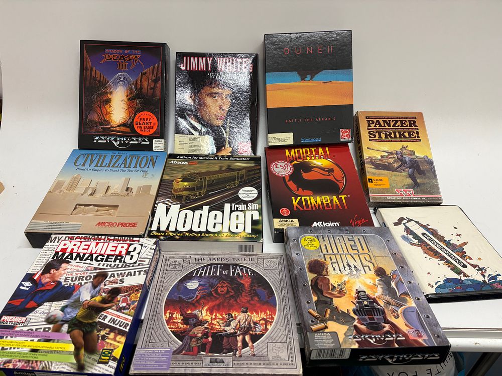 Lot 522: A Collection of Vintage Amiga, PC, and Commodore 64/128 Video Games, Late 1980s-Mid 1990s