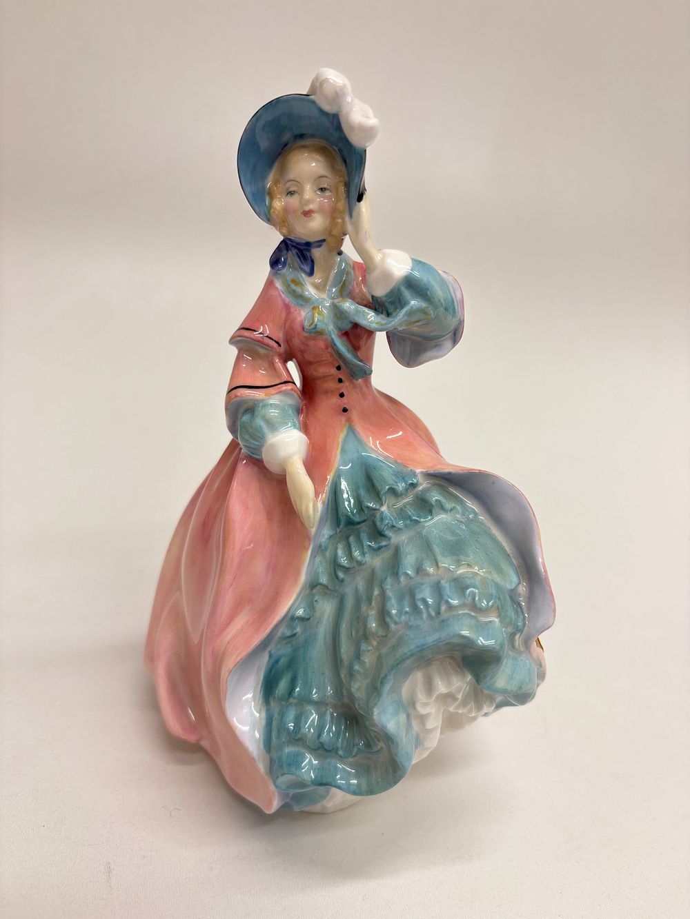 Lot 558: A Royal Doulton Bone China Figurine, 'Spring Morning', HN1922