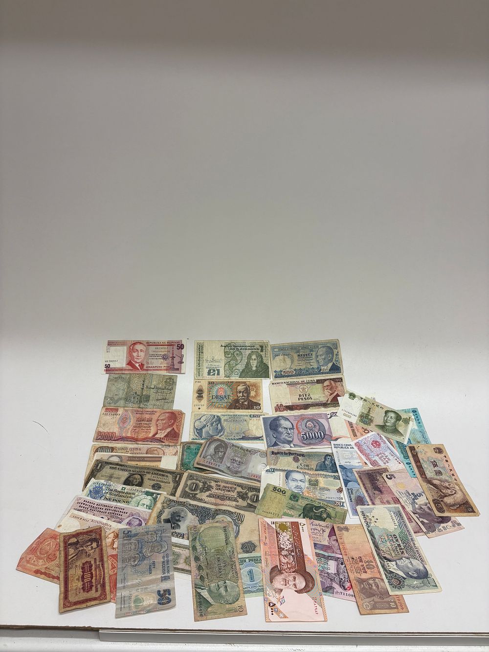 Lot 563:  Different World Banknotes, including a 1935 US Silver Certificate and Two Regional Pound Notes