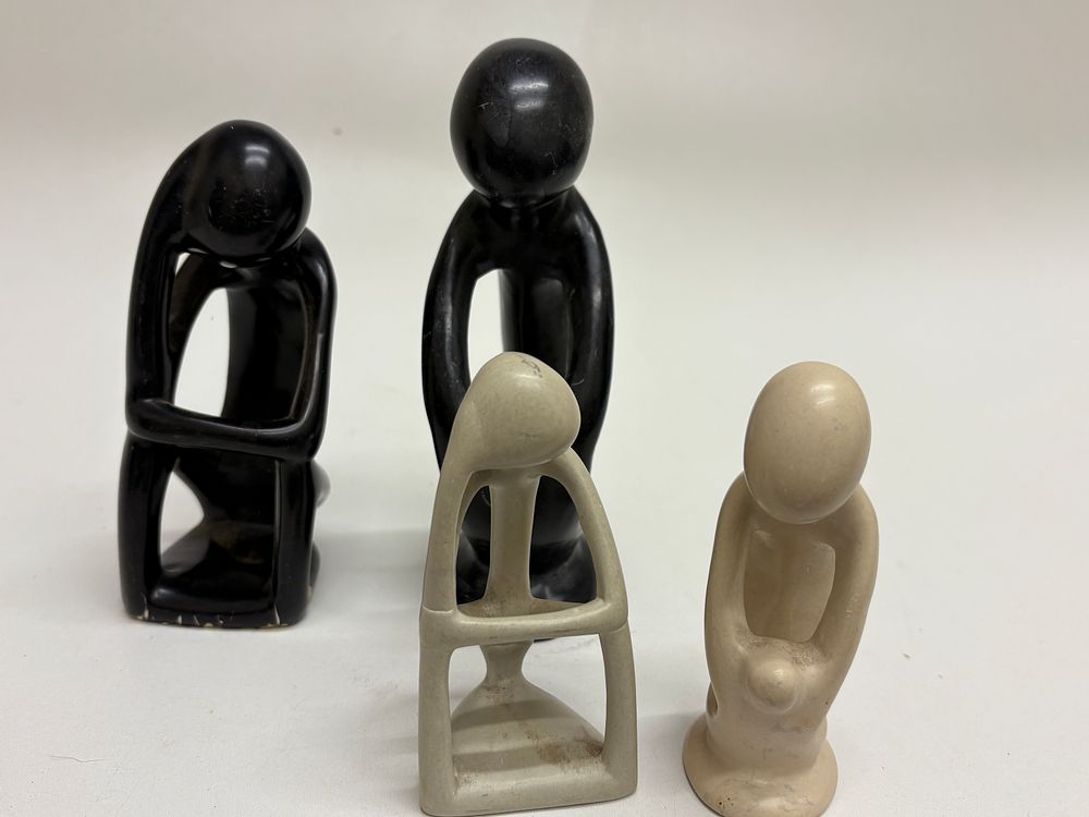 Lot 592: A Group of Four Abstract Soapstone Figurative Sculptures