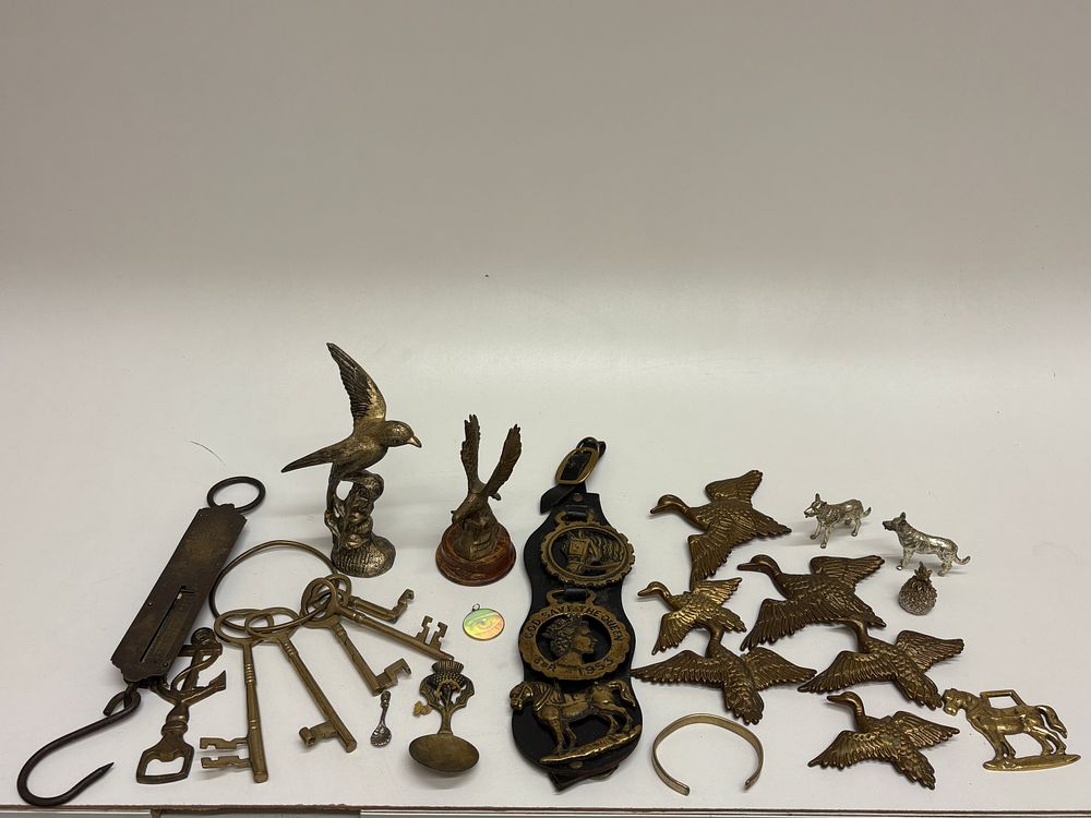 Lot 600: A Collection of Brass and Metalware Decorative Objects, including Horse Brasses, Figurines, and Utilitarian Items