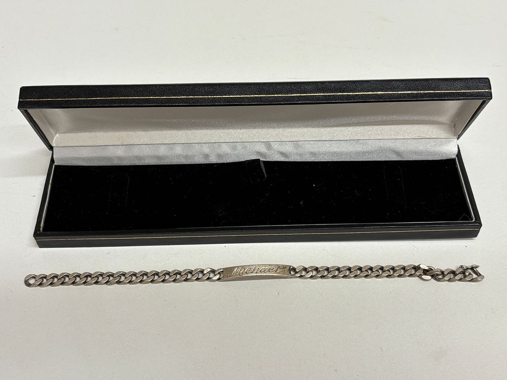 Lot 612: A British Sterling Silver Engraved ID Bracelet
