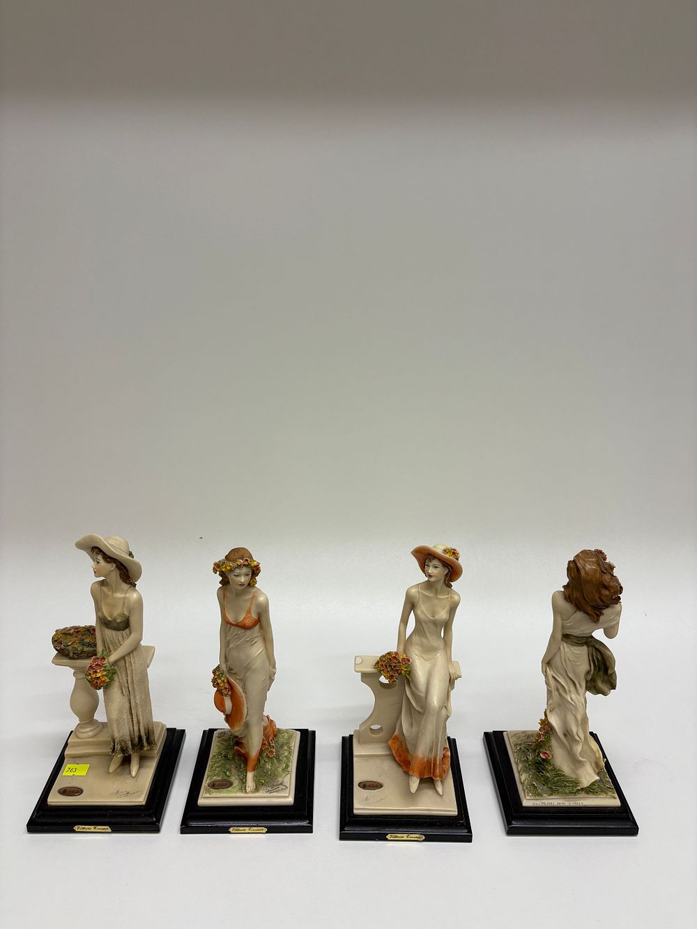 Lot 639: A Group of Four Italian Figurines by Vittorio Tessaro and Claudio Brossi
