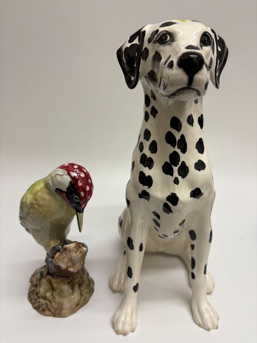 Lot 642: A Pair of Beswick Ceramic Figurines: A Dalmatian (Model No. 2271) and a Woodpecker (Model No. 1218)