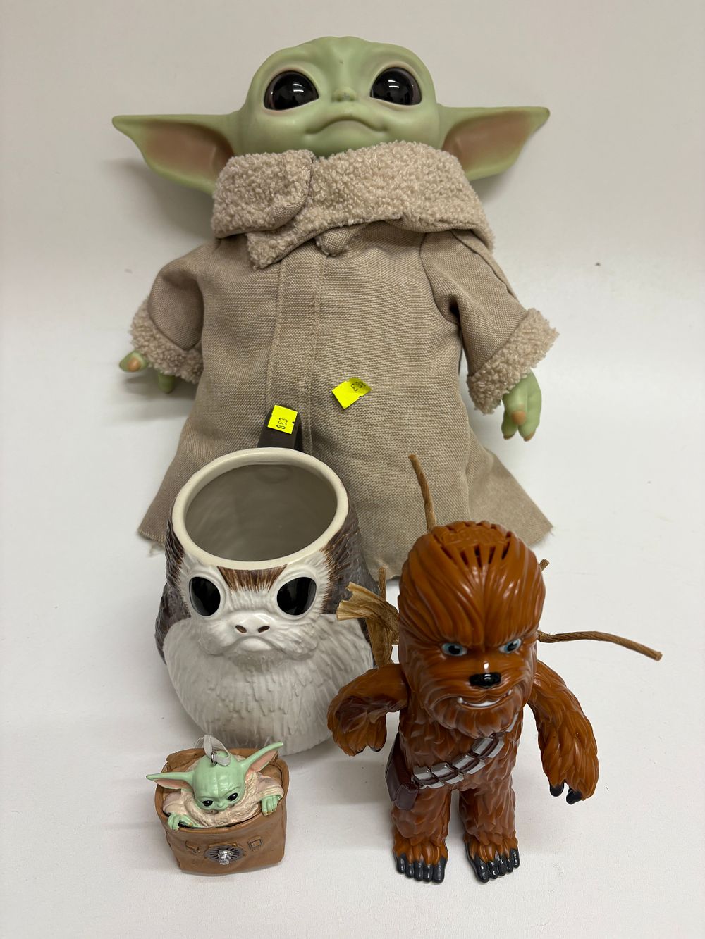 Lot 644: A Group of Star Wars Collectibles by Disney, Lucasfilm, and Hasbro, including Grogu, Porg, and Chewbacca