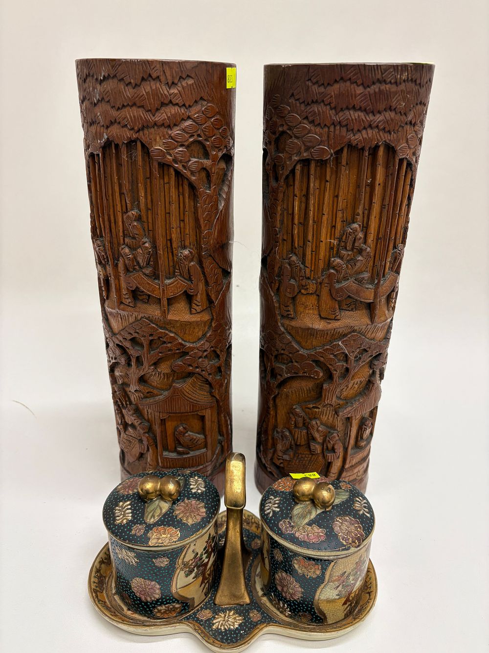 Lot 646: A Pair of Chinese Carved Bamboo Brush Pots, circa 1900s, and a Japanese Satsuma Ware Condiment Set, late 19th Century