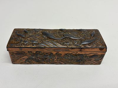 A Meiji Period Copper Relief Box Depicting Dragons and Cetaceans. Meiji Period, circa 1880-1910. 