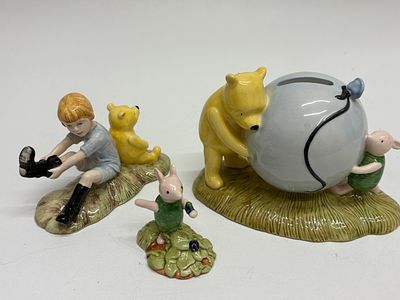 Royal Doulton Winnie the Pooh Collection A Group of four Figurines WP 10 13 16. A collection of 