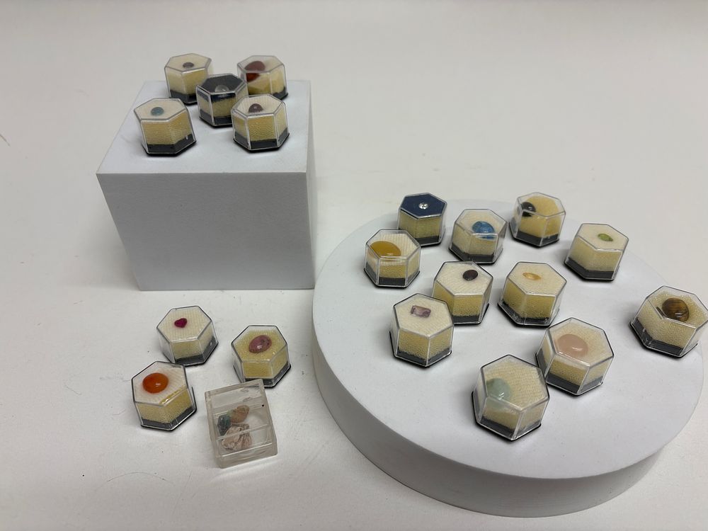Lot 36: A Collection of 20 Gemstone and Mineral Specimens in Hexagonal Display Boxes