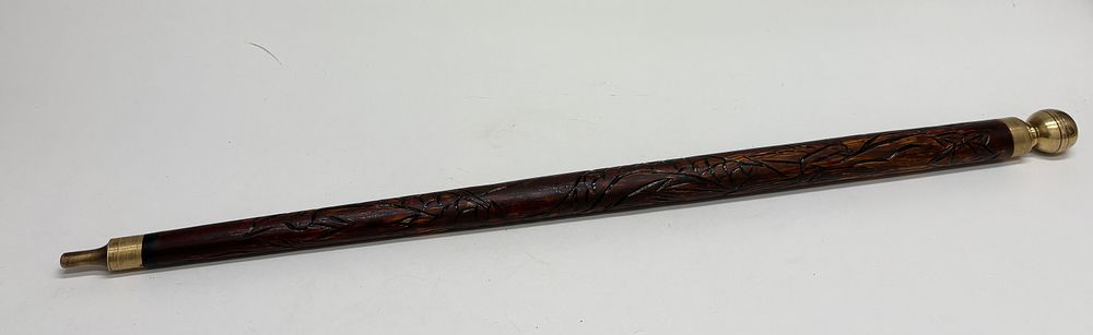 Lot 45: Carved Wood and Brass Dual-Purpose Walking Stick and Pool Cue Ensemble