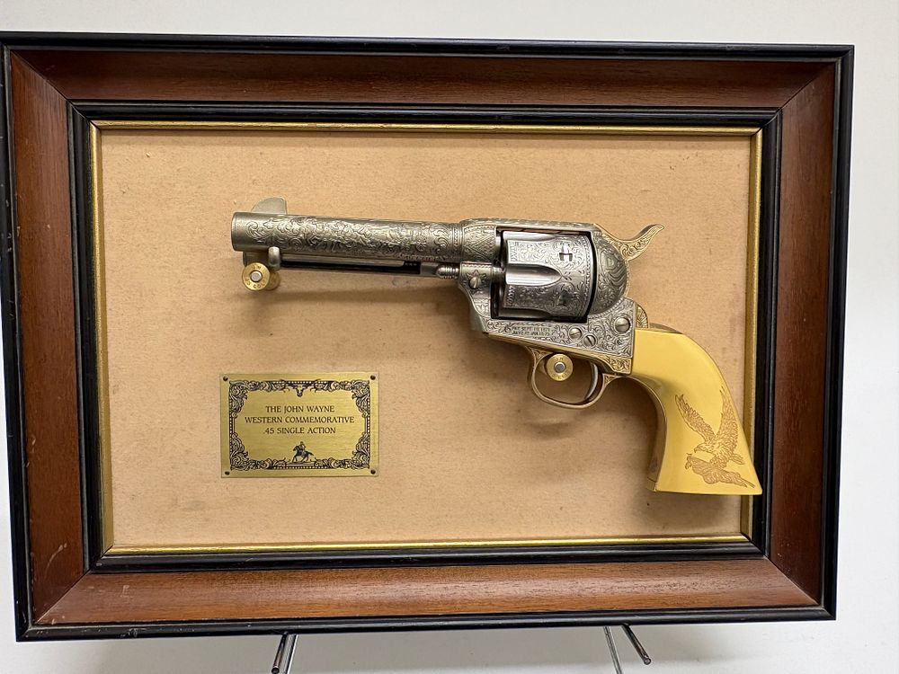 Lot 60: Three John Wayne Commemorative Displays including Franklin Mint .45 Single Action Replica