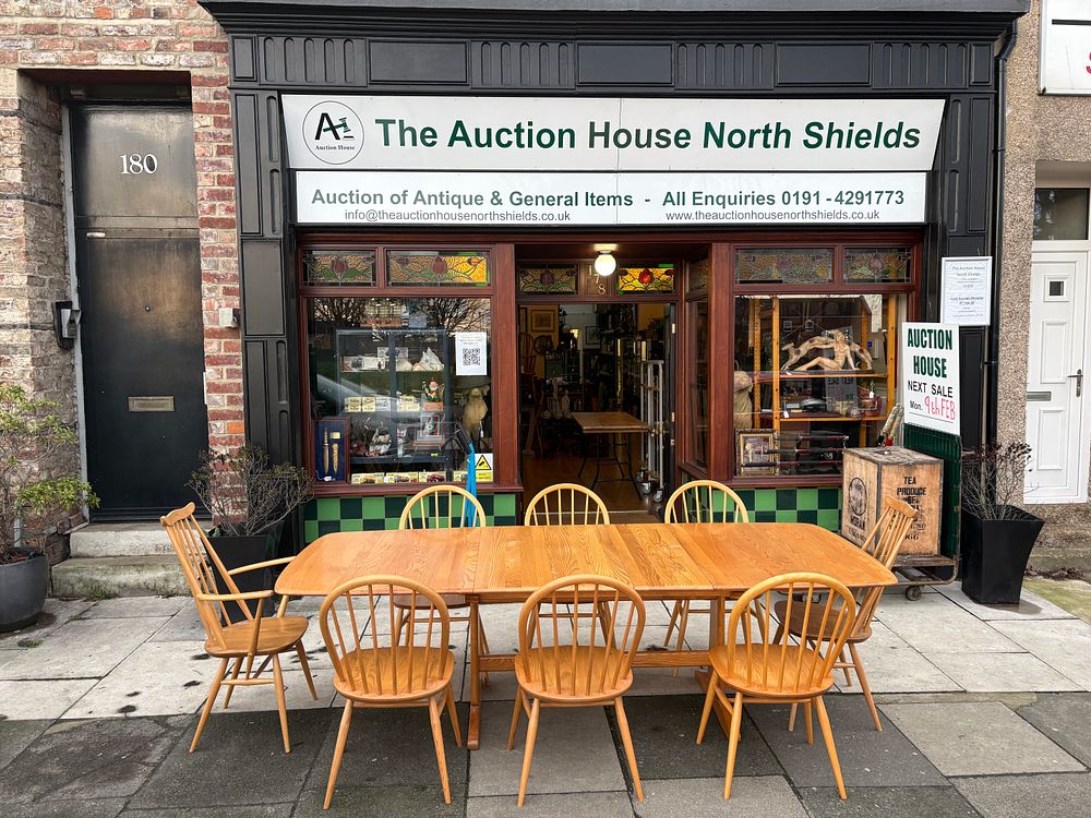 Lot 640: An Ercol Light Finish Extending Dining Table and a Set of Matching Windsor Style Chairs