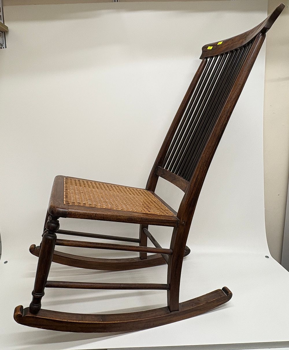 Lot 637: Early 20th Century Colonial Style Stained Teak and Cane Rocking Chair