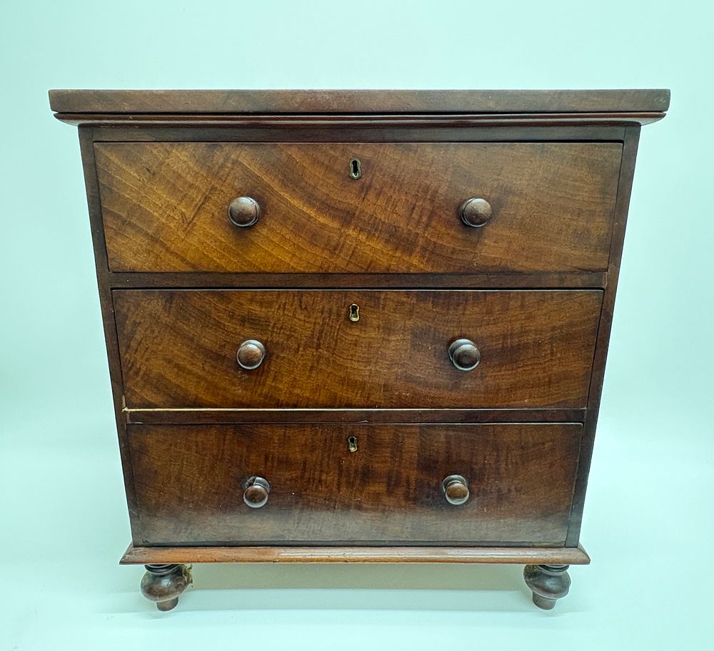 Lot 649: A mid-19th century mahogany apprentice piece chest of drawers