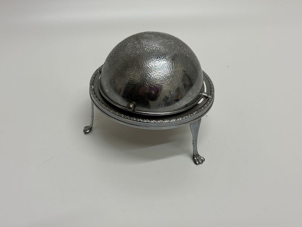 Lot 650: An English Silver Plated Revolving Butter Dish with Glass Liner and Engraved Decoration
