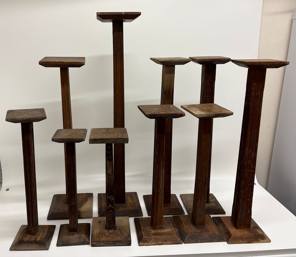 Lot 671: A Collection of Arts and Crafts Style Oak Pedestal Plant Stands