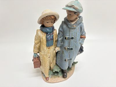 Lladro Gres Porcelain Figurine, Away to School Model 2242, Circa 1990. This fine gres porcelain 