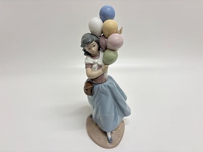 Lladr&oacute;, "Balloon Seller" (Model 5141). A vintage Lladr&oacute; fine glazed porcelain figurine titled 