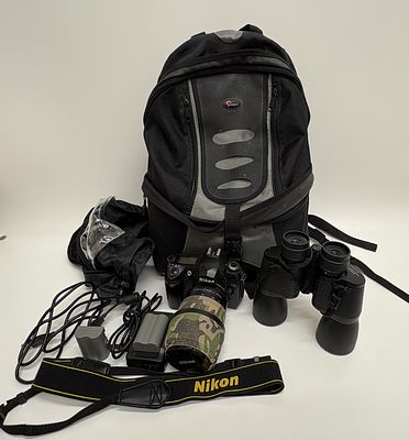 A Collection of Nikon Photography Equipment and a Lowepro Orion Trekker II Backpack. A 