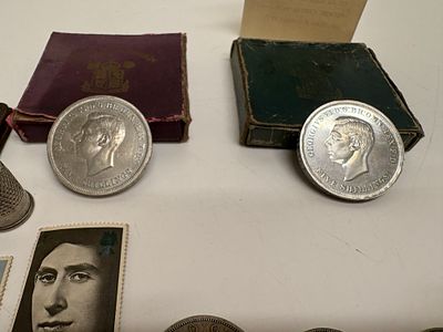 An Assortment of British and International Coins and Stamps including 1951 Festival of Britain 