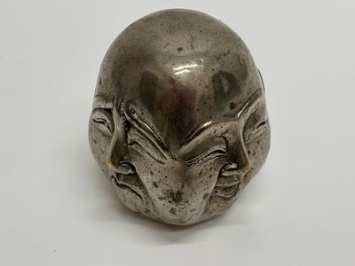 A Chinese Nickel Silver Four Faced Buddha Sculpture. A Chinese cast nickel silver or white metal 