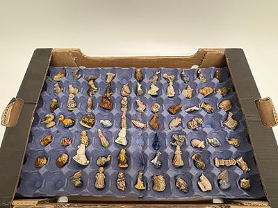 A Collection of Wade Whimsies and Red Rose Tea Ceramic Figurines. A collection of Wade Whimsies 