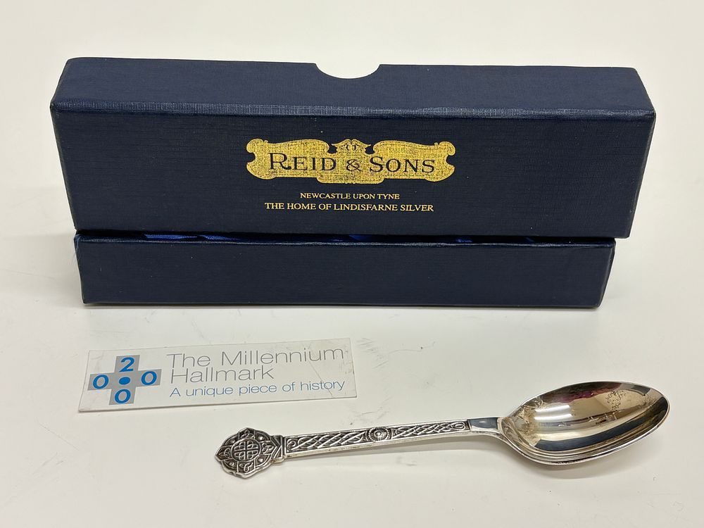 Lot 216: Reid & Sons Ltd, Lindisfarne Pattern Millennium Commemorative Spoon, Sterling Silver 24g