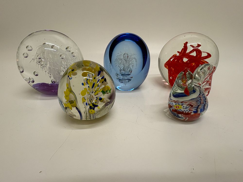 Lot 639: A Collection of Art Glass Paperweights and a Figurine in the Murano Style