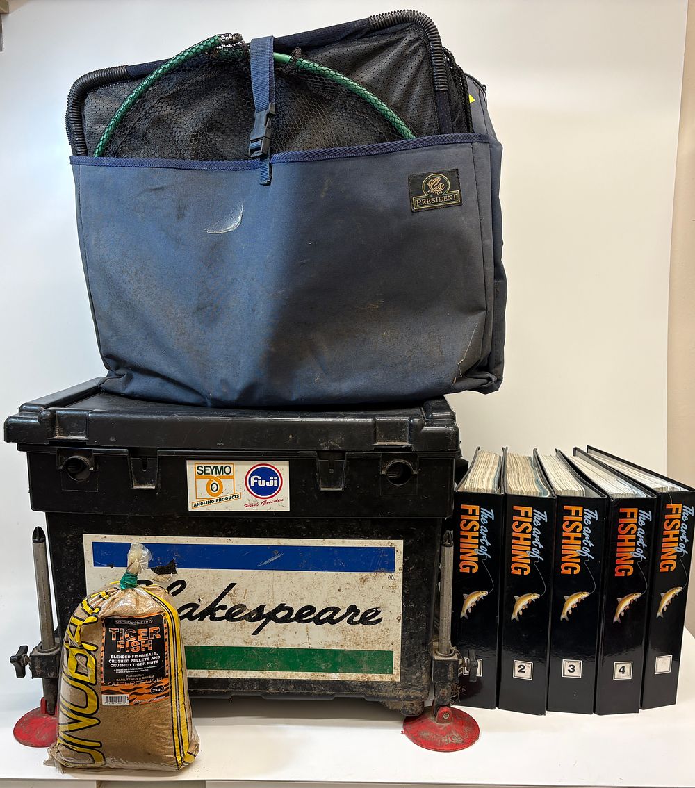 Lot 653: A Collection of Coarse Fishing Tackle including a Shakespeare Seat Box, Daiwa Reels, and Instructional Binders